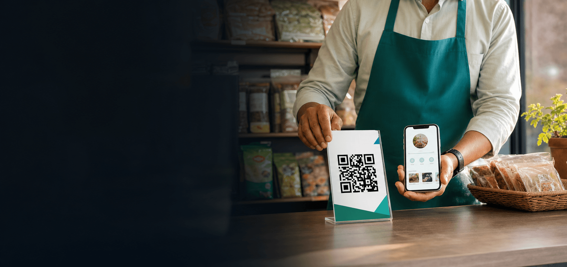 Small business owner displaying a QR profile at the counter